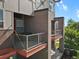 Multi-level townhome with metal balconies and brick facade at 8187 Martin Luther King Blvd, Denver, CO 80238
