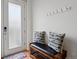 Inviting entryway with coat hooks, a comfortable bench, and a welcoming rug by the door at 8187 Martin Luther King Blvd, Denver, CO 80238