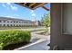 Open porch view looking out to well-maintained landscaping and nearby buildings at 8187 Martin Luther King Blvd, Denver, CO 80238