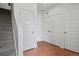 Bright hallway with a staircase and multiple white doors, offering ample storage space at 8187 Martin Luther King Blvd, Denver, CO 80238