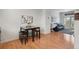 Stylish dining area with a granite-topped table and stools adjacent to a comfortable living room at 8187 Martin Luther King Blvd, Denver, CO 80238