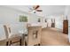 Finished basement dining area with a ceiling fan, carpet, and natural light at 10142 S Turkey Creek Rd, Morrison, CO 80465