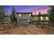 Charming two-story home featuring a two-car garage and a well-maintained front yard at 10142 S Turkey Creek Rd, Morrison, CO 80465