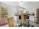 Kitchen with white cabinets, a glass-top dining table, and stainless-steel appliances at 10142 S Turkey Creek Rd, Morrison, CO 80465