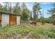 Exterior image of an outdoor shed nestled in a forest with tall green trees at 10142 S Turkey Creek Rd, Morrison, CO 80465