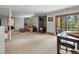 Spacious basement with a carpeted floor, wood stove, and comfortable seating at 30382 Kings Valley East, Conifer, CO 80433