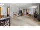 The open basement features neutral carpeting, storage shelves, and a seating area with a wood-burning stove at 30382 Kings Valley East, Conifer, CO 80433