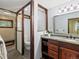 Bathroom featuring a marble countertop and a separate enclosure for the toilet and shower at 30382 Kings Valley East, Conifer, CO 80433