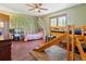 Delightful bedroom featuring fun wall decor, a bunk bed with a slide, and a cozy single bed at 30382 Kings Valley East, Conifer, CO 80433