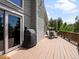 Picture of the spacious wooden deck with a grill, sliding door, and a table with chairs at 30382 Kings Valley East, Conifer, CO 80433