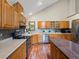 Spacious kitchen boasting wooden cabinets, a kitchen island, and modern stainless steel appliances at 30382 Kings Valley East, Conifer, CO 80433