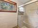 Beautifully tiled shower featuring glass doors and a view of the outdoors at 30382 Kings Valley East, Conifer, CO 80433