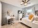 Comfortable bedroom featuring a ceiling fan, natural light, and a workstation at 625 Pearl St # 23, Boulder, CO 80302