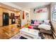 Cozy living space with an open kitchen concept, flooded with natural light from large windows at 625 Pearl St # 23, Boulder, CO 80302