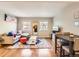 Open-concept living area featuring hardwood floors, a comfortable couch, and stylish dining area at 625 Pearl St # 23, Boulder, CO 80302