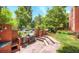 Charming patio area with outdoor kitchen, built-in grill, and beautiful brickwork for entertaining at 625 Pearl St # 23, Boulder, CO 80302