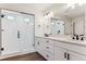 Modern bathroom with large shower, glass enclosure, and double sink vanity at 4728 Twelve Oaks Way, Castle Rock, CO 80104