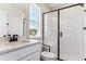 Bathroom featuring modern shower with glass door and white countertop sink at 4728 Twelve Oaks Way, Castle Rock, CO 80104