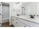 Modern bathroom featuring double sinks with white countertops and a shower-tub combo at 4728 Twelve Oaks Way, Castle Rock, CO 80104