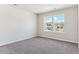 Bright bedroom with carpet and double windows providing neighborhood views at 4728 Twelve Oaks Way, Castle Rock, CO 80104