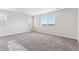 Spacious bedroom featuring carpet and large windows with a view at 4728 Twelve Oaks Way, Castle Rock, CO 80104