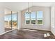 Bright dining room with vaulted ceilings, large windows, and access to the outdoor deck at 4728 Twelve Oaks Way, Castle Rock, CO 80104