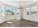 Bright dining area with ample windows and stylish light fixture offers an inviting atmosphere at 4728 Twelve Oaks Way, Castle Rock, CO 80104