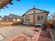 Backyard with fire pit area, patio, and landscaped spaces create a cozy outdoor living area at 1561 Newton St, Denver, CO 80204