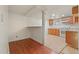 Open basement space with access to a kitchenette and a mixture of flooring types at 1561 Newton St, Denver, CO 80204
