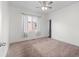 Bright bedroom with carpet, a large window, and neutral decor at 1561 Newton St, Denver, CO 80204