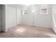 Bedroom with a large open area featuring carpeted floors and neutral paint at 1561 Newton St, Denver, CO 80204
