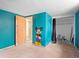 A bedroom with a mural and an open closet at 1561 Newton St, Denver, CO 80204