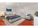 Cozy bedroom with a comfortable bed, an area rug, and lots of natural light at 1561 Newton St, Denver, CO 80204