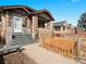 A welcoming bungalow-style house featuring a charming front yard and inviting entrance at 1561 Newton St, Denver, CO 80204