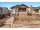 Charming bungalow with brick accents, covered porch, and inviting curb appeal at 1561 Newton St, Denver, CO 80204