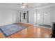 Bright living room with hardwood floors, a ceiling fan, and a decorative rug at 1561 Newton St, Denver, CO 80204