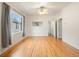 Bright living room boasting hardwood floors, ceiling fan, and ample natural light at 1561 Newton St, Denver, CO 80204