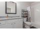 Bathroom featuring white cabinets, granite countertop, and a tiled shower/tub combo at 12513 Shore Point St, Firestone, CO 80504