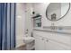 Bathroom featuring a shower-tub combo with white vanity and brushed nickel faucet at 12513 Shore Point St, Firestone, CO 80504