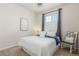 Well-lit bedroom with plush carpeting, complemented by an accent chair at 12513 Shore Point St, Firestone, CO 80504
