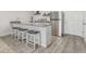A modern kitchenette with stainless steel appliances and bar stool seating at 12513 Shore Point St, Firestone, CO 80504