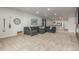 A comfortable living room with a large sectional sofa and a decorative clock at 12513 Shore Point St, Firestone, CO 80504