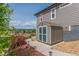 Backyard view of a storage shed and beautifully landscaped yard at 12513 Shore Point St, Firestone, CO 80504