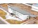 Aerial view of modern home with patio, outdoor furniture, fenced yard, and private driveway at 2650 W Asbury Ave, Denver, CO 80219
