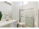 Contemporary bathroom features a sleek vanity, modern fixtures, and a glass-enclosed shower at 2650 W Asbury Ave, Denver, CO 80219