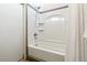 Clean bathroom with tiled shower and tub at 2650 W Asbury Ave, Denver, CO 80219