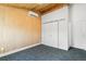 Bright bedroom features wood ceiling, closet, and air conditioning unit at 2650 W Asbury Ave, Denver, CO 80219