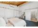 Relaxing bedroom with a cozy bed, modern decor, and an ensuite bathroom with a glass-enclosed shower at 2650 W Asbury Ave, Denver, CO 80219