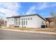 Modern home with light color scheme, square windows, and a seating area at 2650 W Asbury Ave, Denver, CO 80219