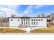 Modern home with a light color scheme, square windows, and a walkway at 2650 W Asbury Ave, Denver, CO 80219